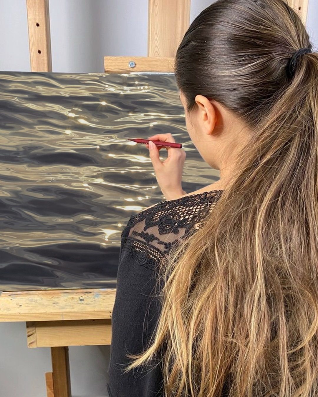 Carina Francioso painting Liquid Gold in her studio